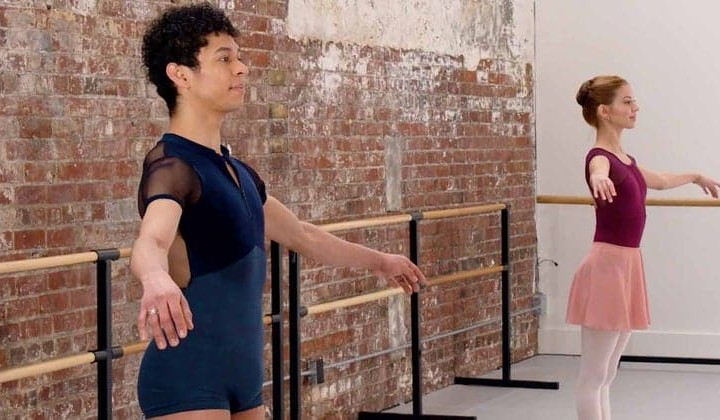 Image of two dancers in a studio