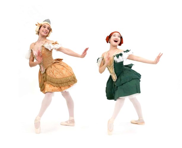 Image of two dancers posing in costume