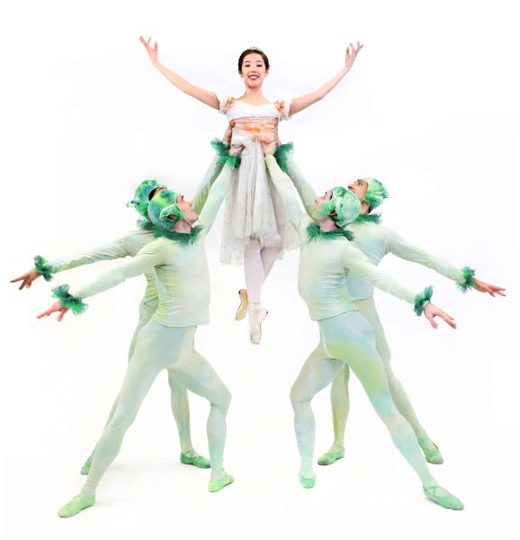 Image of dancers in costume holding up Cinderella